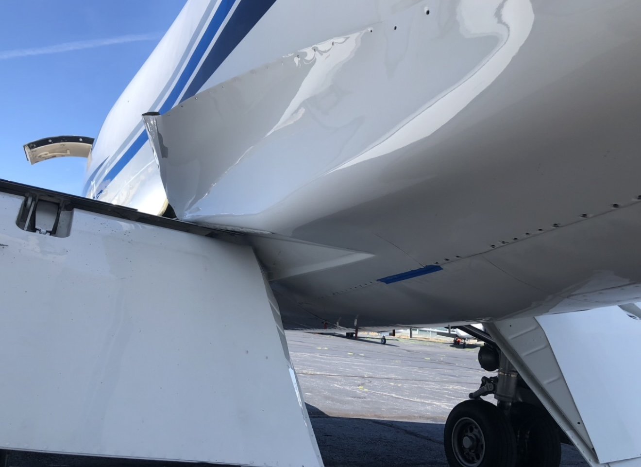 Learjet 55 fairing peeled back in flight